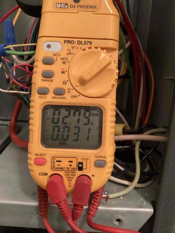 # HVAC Cooling Maintenance Completed

Performed routine cooling system maintenance as part of ongoing preventive service plan. Conducted comprehensive electrical diagnostics using digital multimeter to verify proper system operation, measuring voltage and capacitance readings throughout the air conditioning unit. All electrical components tested within manufacturer specifications with display readings indicating normal operating parameters.

Inspected condensate drainage system and verified proper water removal from evaporator coil. Drainage buckets positioned to monitor and collect condensate discharge, ensuring no overflow or backup issues. Checked all refrigerant lines, ductwork connections, and insulation integrity throughout the mechanical space. System operating efficiently with no immediate repairs required. Documented equipment condition with photographic records for service history.