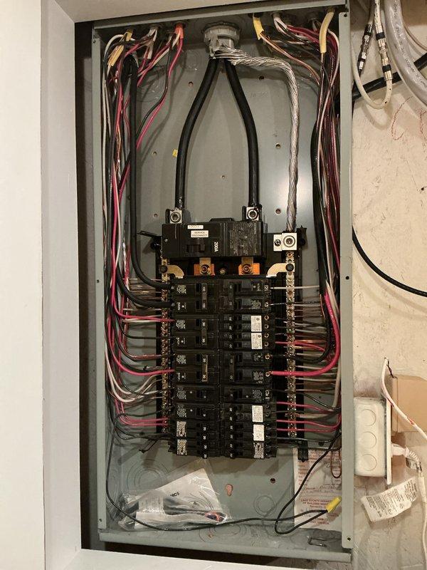 Completed comprehensive electrical panel inspection at residential property. Thoroughly examined two main distribution panels, documenting circuit breaker configurations, wire routing, bus bar connections, and overall system integrity. Verified proper wire color coding, conductor sizing, and termination methods throughout both panels. Photographed all components including main breakers, branch circuit breakers, neutral and ground bus connections, and incoming service conductors for record-keeping purposes. All findings documented for client review and future reference.