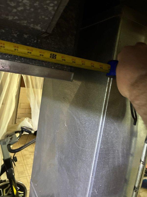 Conducted on-site assessment for HVAC system replacement in residential basement installation. Performed detailed measurements of existing furnace unit and supply ductwork to determine equipment specifications and clearance requirements for new system installation. Documented current equipment configuration including condensate drainage system with PVC piping arrangement and evaluated accessibility for replacement procedures.