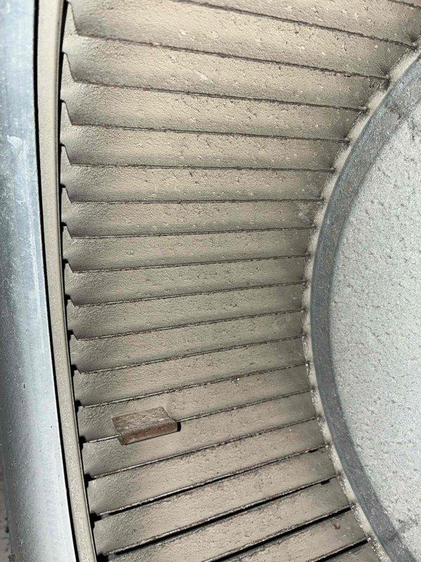 Completed comprehensive cooling system maintenance on residential HVAC unit. Inspected blower assembly and found moderate dust accumulation on squirrel cage fan blades, which was cleaned to restore optimal airflow efficiency. Performed electrical diagnostics on outdoor condensing unit using digital multimeter, verifying voltage readings and confirming proper system operation at 497.8 volts on tested circuit.