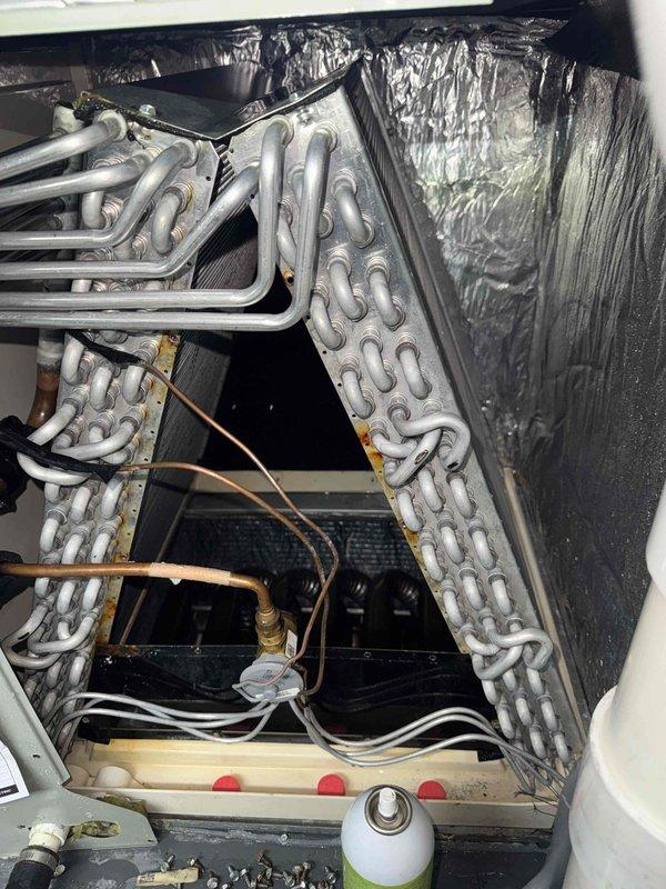 Returned to complete follow-up work on HVAC unit. Added drain tabs to condensate pan for proper drainage. Performed thorough coil wash on evaporator coils to remove accumulated debris and improve heat transfer efficiency. Installed compressor saver hard start kit to protect compressor and enhance system reliability.