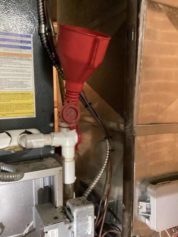 Completed routine cooling maintenance on residential HVAC system, including inspection of furnace components, blower motor, gas burners, and control mechanisms. Inspected condensate drainage system with red funnel collection point and verified proper operation of PVC discharge piping. Customer requested quote for replacement of existing smart thermostat with standard non-programmable thermostat.