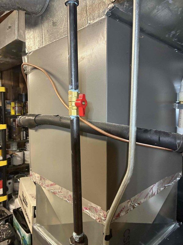 Successfully installed a new 96% efficiency furnace system with complete ductwork integration. Connected gas supply line with shutoff valve and brass fittings, installed insulated refrigerant lines, and secured all HVAC components within the existing mechanical space. System tested and operational upon completion.