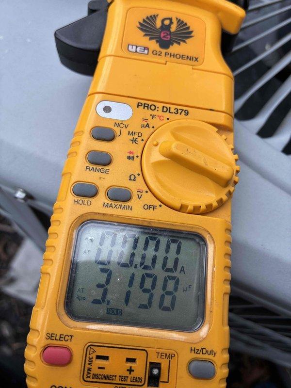 Performed comprehensive cooling system maintenance and diagnostics. Utilized digital multimeter to verify electrical parameters and amperage readings, confirming proper system operation. Identified and documented excessive frost accumulation on evaporator coil surface, with temperature measurements indicating 55°F at the coil, suggesting potential airflow restriction or refrigerant charge issues requiring monitoring.