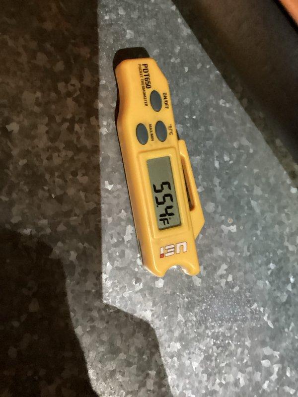 Performed comprehensive cooling system maintenance and diagnostics. Utilized digital multimeter to verify electrical parameters and amperage readings, confirming proper system operation. Identified and documented excessive frost accumulation on evaporator coil surface, with temperature measurements indicating 55°F at the coil, suggesting potential airflow restriction or refrigerant charge issues requiring monitoring.