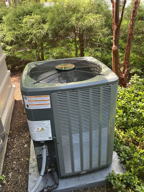 Completed annual preventative maintenance service on residential split-system air conditioning unit as part of scheduled maintenance plan. Performed comprehensive inspection of outdoor condensing unit, which was found in good operating condition with no visible signs of damage, corrosion, or deterioration. Unit is properly positioned on concrete pad with adequate clearance and surrounded by well-maintained landscaping. Verified all manufacturer labels and safety decals are present and legible. Inspected fan assembly, cabinet louvers, and external components for proper condition. Confirmed refrigerant line set and associated piping connections are secure with no visible signs of leakage or damage. System demonstrates normal operational characteristics consistent with routine maintenance visit.