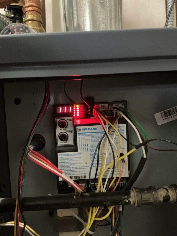 Completed comprehensive first-year preventive maintenance on residential hydronic boiler system. Performed thorough inspection of all major components including boiler control board displaying normal operational status code, expansion tank, circulator pumps, and associated piping network. Verified proper operation of all safety controls, checked system pressures, inspected copper and black iron piping for leaks or corrosion, confirmed ball valve functionality throughout the heating loop, and documented system condition with photographic records. All components found operating within manufacturer specifications with no deficiencies noted.