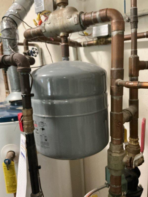 Completed comprehensive first-year preventive maintenance on residential hydronic boiler system. Performed thorough inspection of all major components including boiler control board displaying normal operational status code, expansion tank, circulator pumps, and associated piping network. Verified proper operation of all safety controls, checked system pressures, inspected copper and black iron piping for leaks or corrosion, confirmed ball valve functionality throughout the heating loop, and documented system condition with photographic records. All components found operating within manufacturer specifications with no deficiencies noted.