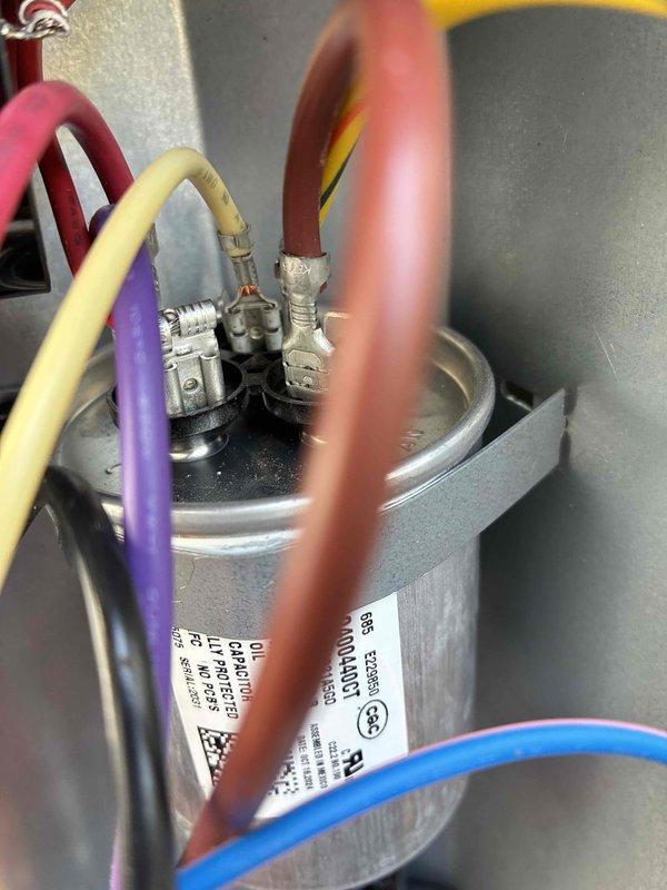 Responded to second service call for hard start issue on outdoor condensing unit. Upon inspection, found failed dual run capacitor preventing proper compressor startup. Performed coil cleaning on outdoor unit to restore proper airflow and heat transfer efficiency. Replaced defective capacitor with new dual run capacitor, reconnected all electrical terminals, and verified proper wire connections. System tested successfully with normal startup and operation confirmed.