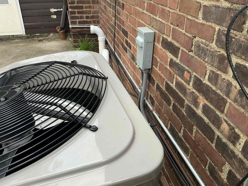 Conducted estimate for air conditioning system replacement after unit sustained damage from falling ice during winter months. Evaluated outdoor condenser unit positioned on concrete pad against building exterior and inspected interior HVAC components including ductwork connections and air handling equipment. Provided customer with multiple replacement options ranging from condenser-only replacement to complete system upgrade based on extent of ice damage to existing equipment.