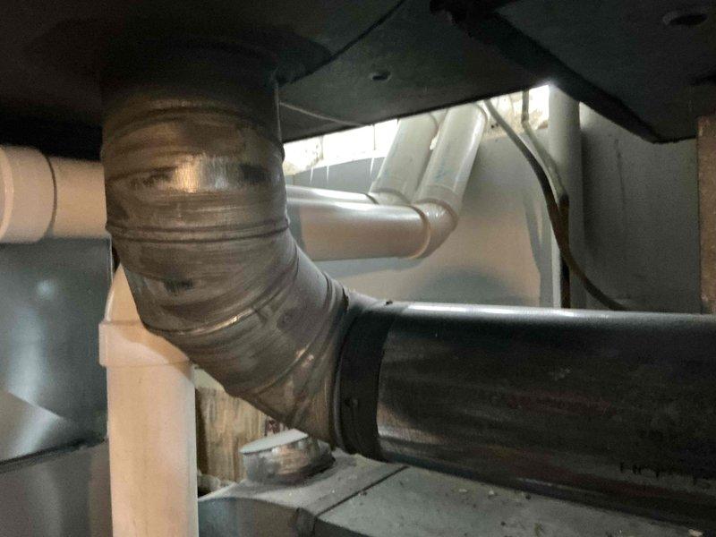 Conducted estimate for air conditioning system replacement after unit sustained damage from falling ice during winter months. Evaluated outdoor condenser unit positioned on concrete pad against building exterior and inspected interior HVAC components including ductwork connections and air handling equipment. Provided customer with multiple replacement options ranging from condenser-only replacement to complete system upgrade based on extent of ice damage to existing equipment.