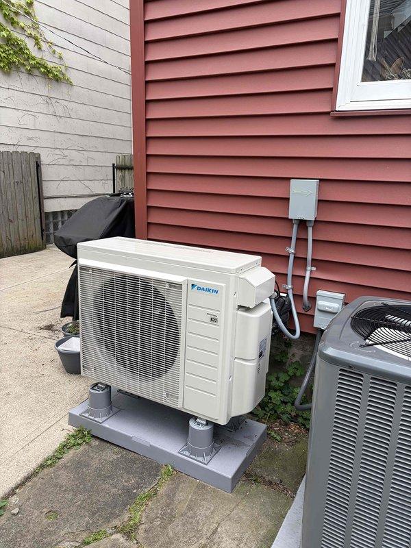 Replaced existing condenser unit with new Daikin outdoor air conditioning system, including installation on concrete pad with proper refrigerant line routing and electrical disconnect. Assisted with mobile app setup and WiFi connectivity configuration for the Daikin indoor unit (model FTXV09AVJU9) to enable remote system control and monitoring.