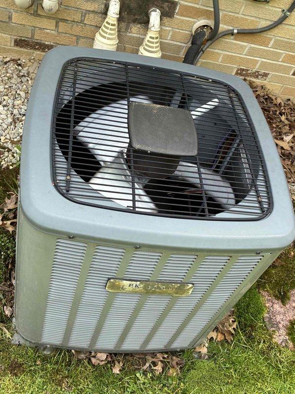 Completed scheduled HVAC maintenance on residential cooling system, including inspection of outdoor condenser unit and internal electrical components. Inspected capacitor, wiring connections, and contactor assembly; all electrical components found to be functioning within normal parameters with secure wire connections and proper terminal contact. Condenser unit exterior shows normal weathering consistent with outdoor installation age; unit operating properly with adequate airflow through louvered panels and fan assembly functioning correctly.