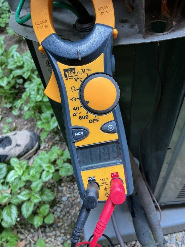 Completed scheduled HVAC boiler maintenance inspection and system diagnostics. Verified proper operation of all electrical components, tested control board functionality with digital display reading 30°F, and performed amperage measurements using clamp meter to confirm system is operating within manufacturer specifications.
