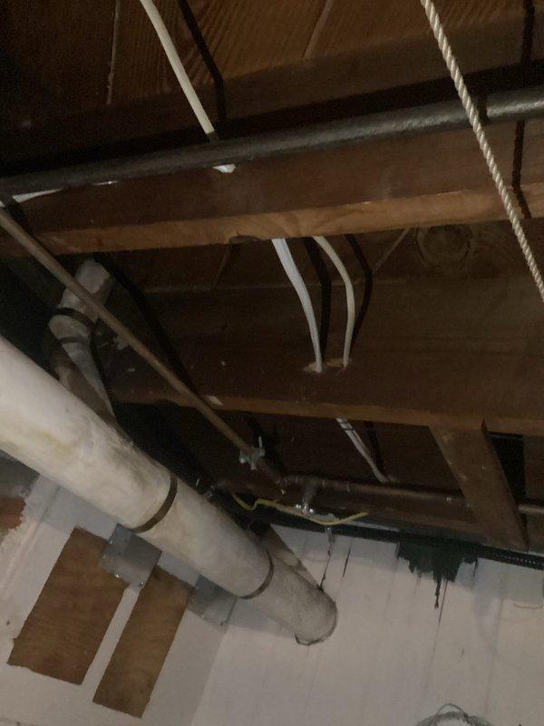 Relocated existing AC circuit and associated electrical components to accommodate customer needs. Accessed exterior meter installation and basement crawl space to reroute wiring through floor joists and structural supports. Installed new conduit routing, secured electrical cables with appropriate hangers and mounting brackets, and verified proper circuit protection and meter functionality. All work completed to code specifications with system tested and operational upon completion.