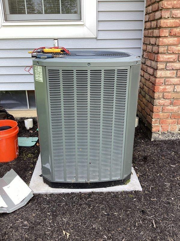 Completed scheduled cooling system maintenance on residential outdoor condensing unit. Performed comprehensive inspection of condenser components, checked electrical connections and capacitor operation, verified proper airflow through louvered panels, and ensured unit was operating within manufacturer specifications. System tested and confirmed ready for cooling season operation.