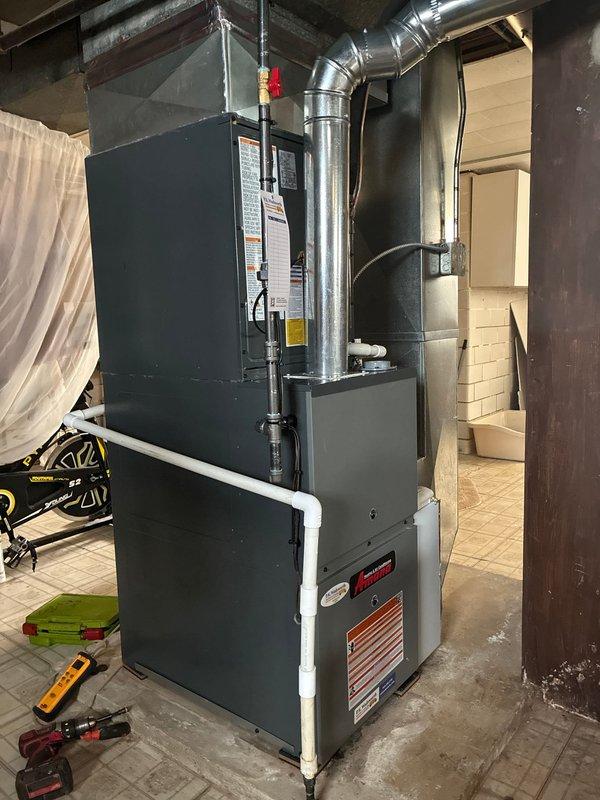 Completed full HVAC system installation including 80% efficiency furnace and air conditioning unit in residential basement location. Installed new furnace unit with associated ductwork connections, PVC venting and condensate drain line, ensuring proper integration with existing infrastructure and code compliance. System tested and verified operational upon completion, with customer financing arranged through GreenSky.