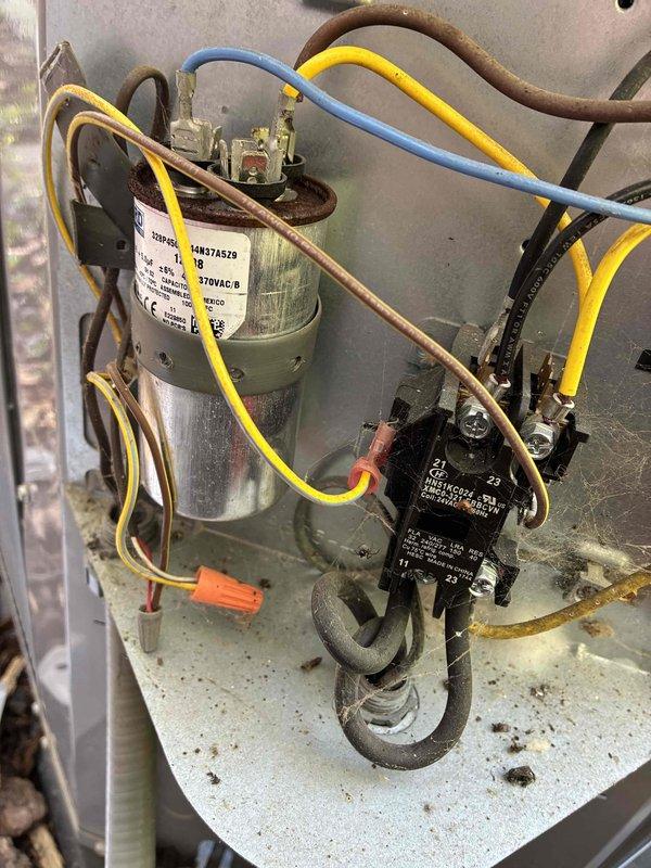 # HVAC Cooling Maintenance Completed

Performed comprehensive preventive maintenance on residential air conditioning system as part of scheduled cooling season service. Conducted thorough inspection of outdoor condensing unit, noting accumulation of landscaping mulch and organic debris around refrigerant line connections and base of equipment. Cleared debris from around piping and valve assemblies to ensure proper airflow and prevent potential corrosion or pest intrusion.

Accessed electrical control panel and inspected internal components including capacitor, contactor, and associated wiring connections. Verified all electrical connections were secure with proper wire terminations. Capacitor tested within acceptable parameters. Contactor examined for signs of pitting or wear on contact points. Refrigerant lines inspected for signs of leakage or deterioration, with copper tubing showing normal surface oxidation consistent with age. All mechanical and electrical components found to be i