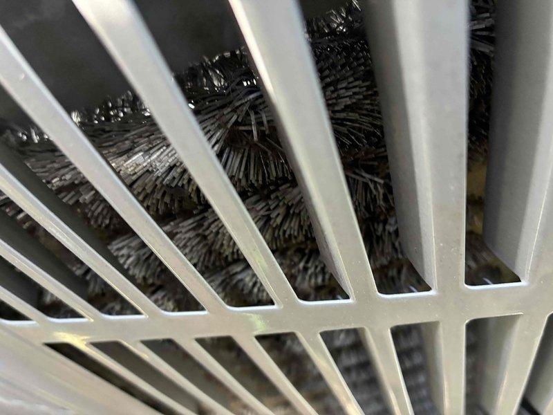 Completed comprehensive cooling system maintenance on residential HVAC unit. Inspected evaporator coil through air return grille, confirming proper fin condition and airflow capacity, and verified exterior condensing unit electrical disconnect and refrigerant line connections at building exterior. All components operating within normal parameters with no deficiencies noted.