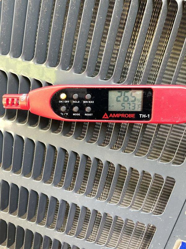 Completed comprehensive cooling system maintenance on residential HVAC unit located in basement utility area. Performed standard preventive maintenance procedures including inspection of furnace and cooling components, verification of proper airflow through heat exchanger coils, and temperature differential measurements using calibrated digital thermometer. Measured supply and return air temperatures across evaporator coil, recording readings of 26.5°F and 5.33°F differential, confirming adequate system performance and refrigerant charge levels within manufacturer specifications. Noted minor dust and debris accumulation on aluminum fins of heat exchanger unit, which is normal for seasonal operation. All ductwork connections, including flexible ducting, inspected and found secure with no visible air leaks. System operational and functioning properly upon completion of maintenance service.