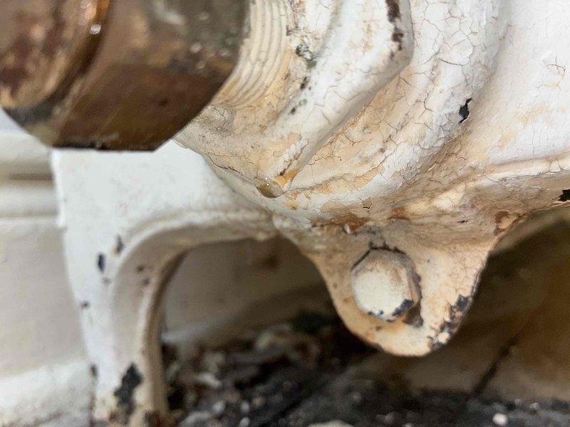 Replaced deteriorated expansion tank and failed thermostatic pressure relief valve on water heating system. Both components showed extensive corrosion, paint failure, and water damage indicating end of service life, requiring immediate replacement to restore safe system operation.