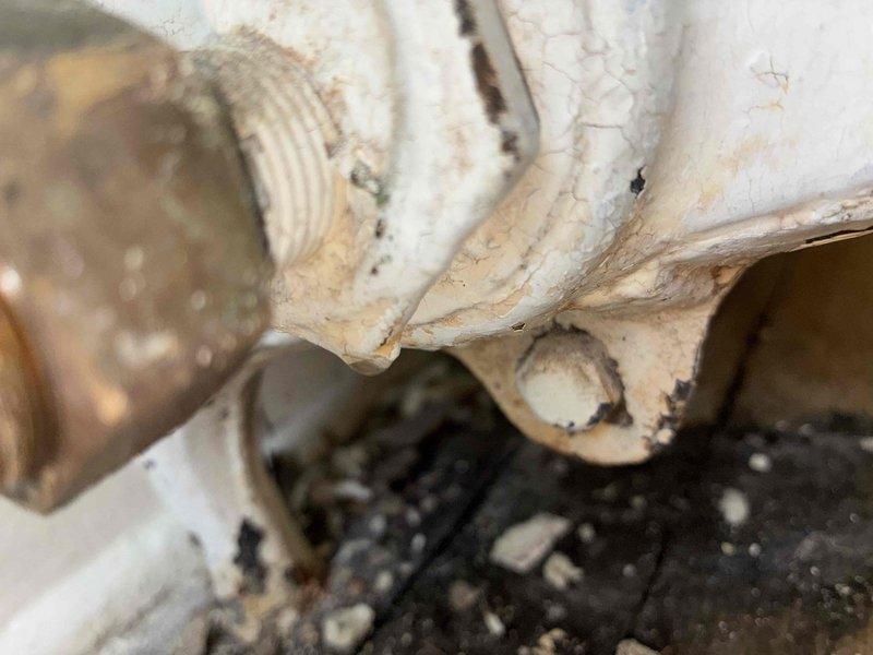 Replaced deteriorated expansion tank and failed thermostatic pressure relief valve on water heating system. Both components showed extensive corrosion, paint failure, and water damage indicating end of service life, requiring immediate replacement to restore safe system operation.