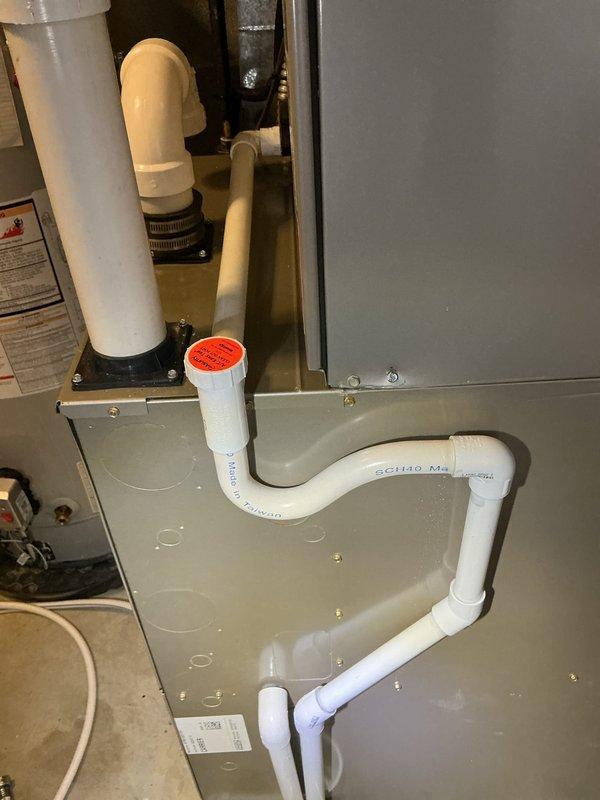 Completed comprehensive HVAC cooling system maintenance on residential unit, which included inspection of air handler, condensate drainage system, and humidifier components. All PVC drainage piping, fittings, and cleanout access points were verified for proper operation and secure mounting, with condensate flow confirmed through the system. Equipment was found to be in good working condition with all electrical connections secure and system operating within normal parameters.