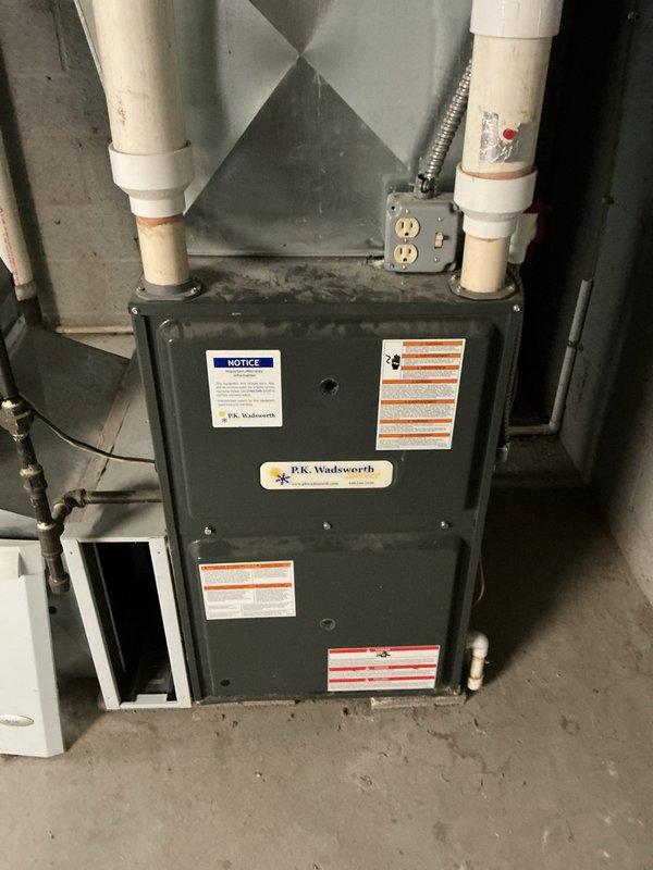 Completed routine cooling system maintenance on residential HVAC unit. Performed refrigerant pressure diagnostics using digital manifold gauges, confirming R410A refrigerant charge at 232.0 PSIG on high side with system operating within normal parameters at 69°F ambient temperature. Inspected furnace cabinet, venting components, and associated electrical connections for proper operation and safety compliance.