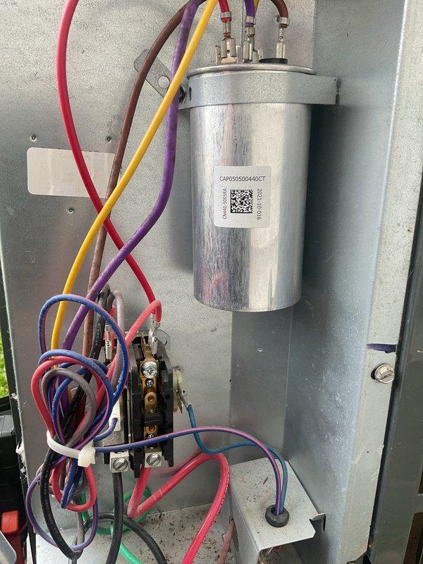 Completed scheduled preventative maintenance on residential split-system air conditioning unit. Performed comprehensive inspection of outdoor condenser unit, verified proper operation of compressor and condenser fan motor, and confirmed adequate airflow through coil louvers. Inspected and tested dual-run capacitor (CAP050D0440CT), verified proper microfarad readings and secure terminal connections across all poles. Checked all electrical connections, contactor operation, and wire terminations for tightness and proper color coding. Confirmed unit is operating within manufacturer specifications and ready for cooling season.