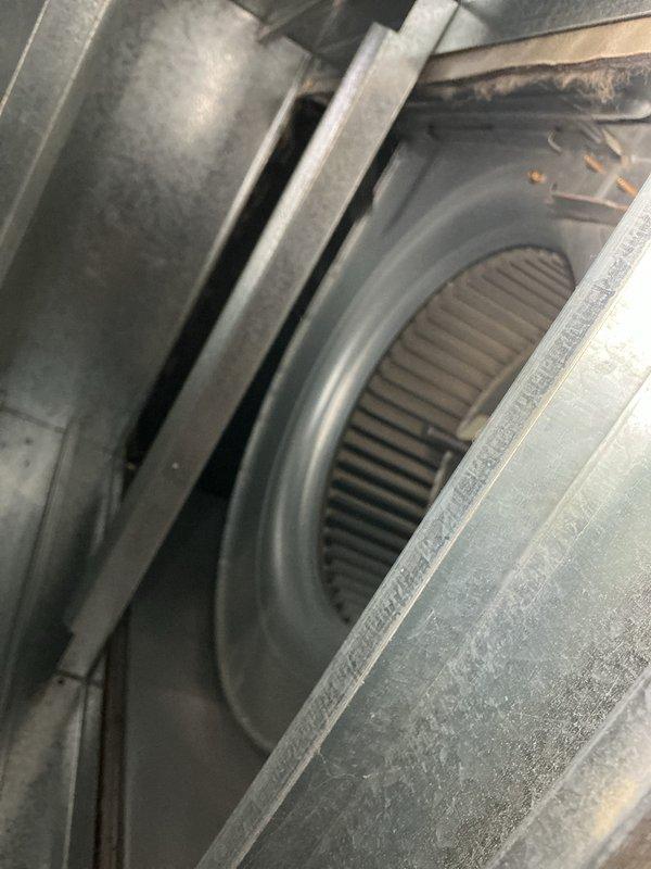 Performed comprehensive cooling system maintenance on residential air conditioning unit. Inspected outdoor condenser unit including coils, fan assembly, and refrigerant lines; verified proper operation and cleared debris from surrounding area. Accessed indoor air handler to inspect blower wheel assembly, noting dust accumulation on components that was addressed during routine cleaning and maintenance procedures to ensure optimal system performance and efficiency.