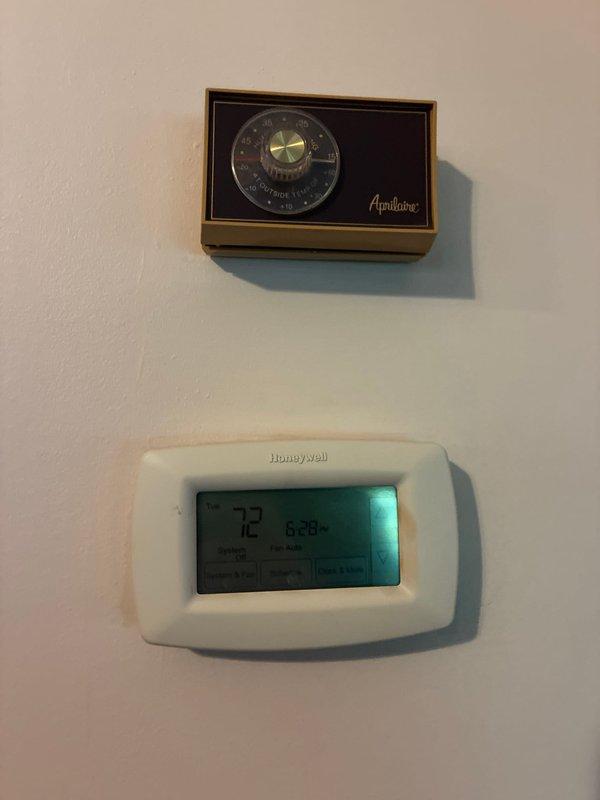 Conducted evening estimate appointment for heat pump replacement on existing aging Rheem system. Evaluated current equipment including vintage Apnliance thermostat and modern Honeywell digital thermostat, as well as outdoor condenser unit. Presented heat pump replacement options and discussed available system promotions with customer.