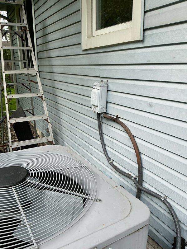 Completed comprehensive estimate for full HVAC system replacement including air conditioning condenser unit, indoor air handler, and tankless water heater installation. Evaluated existing exterior condenser unit mounted on concrete pad with refrigerant lines running to electrical disconnect box, and assessed current electrical panel capacity with existing AC circuits for new equipment specifications.