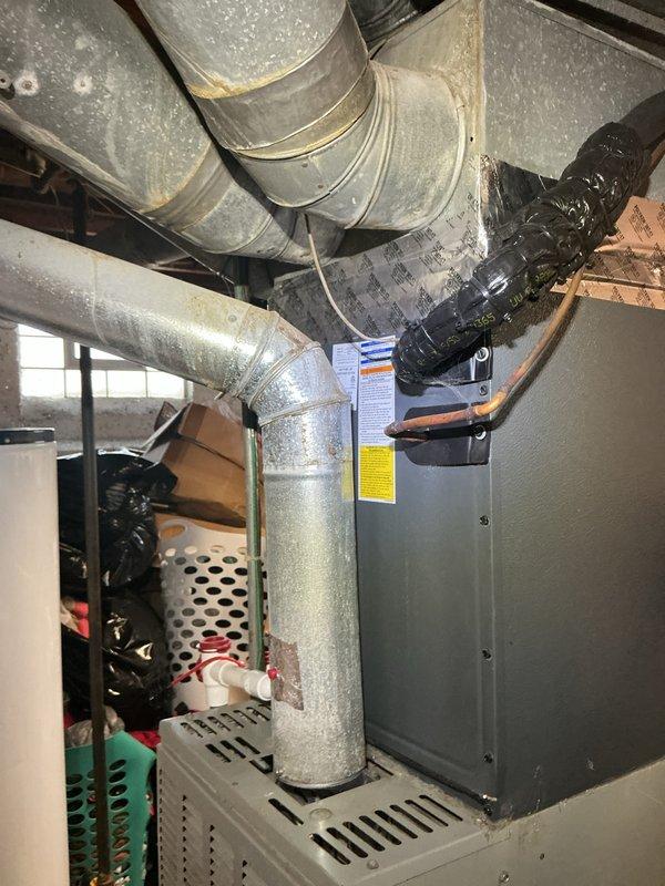 Completed routine cooling maintenance on residential American Standard HVAC system. Performed comprehensive inspection of furnace unit, ductwork, and associated components including condensate drain lines and air handler. Verified all safety labels, operational guidelines, and system connections were intact and functioning properly. Inspected galvanized metal ductwork routing, flexible ducting insulation, and ventilation pathways for proper installation and airflow. System operational and ready for cooling season.