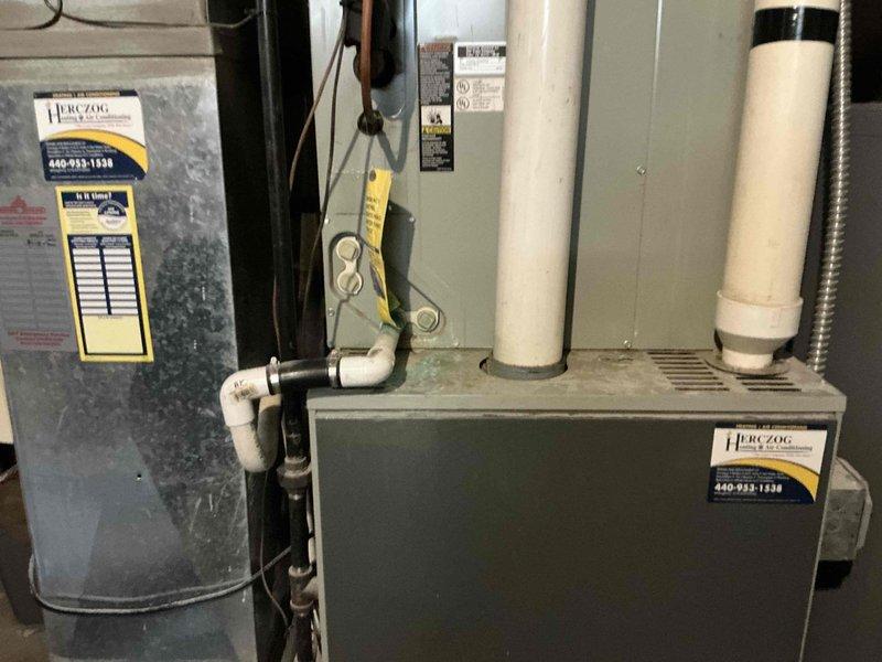Responded to no heat service call at residential property. Performed complete system assessment of existing HVAC equipment and water heater located in basement utility area. Documented current system configuration including furnace, air handler, and associated venting components. Took field measurements of installation area and ductwork layout, noting dimensions for proper equipment sizing and replacement planning. Prepared comprehensive estimate for full HVAC system replacement including new furnace, humidifier, and outdoor condensing unit to restore heating functionality and improve system efficiency.