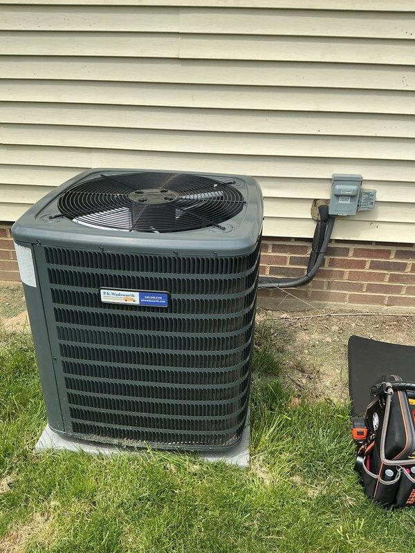 Completed scheduled preventive maintenance on residential split-system air conditioning unit. Performed comprehensive inspection of outdoor condensing unit including visual assessment of cabinet condition, refrigerant line connections, electrical disconnect, and conduit routing. Verified proper unit placement on concrete pad, checked fan operation through protective grille, and confirmed all manufacturer labels and safety warnings were intact and legible. System found operating within normal parameters with no immediate service needs identified.