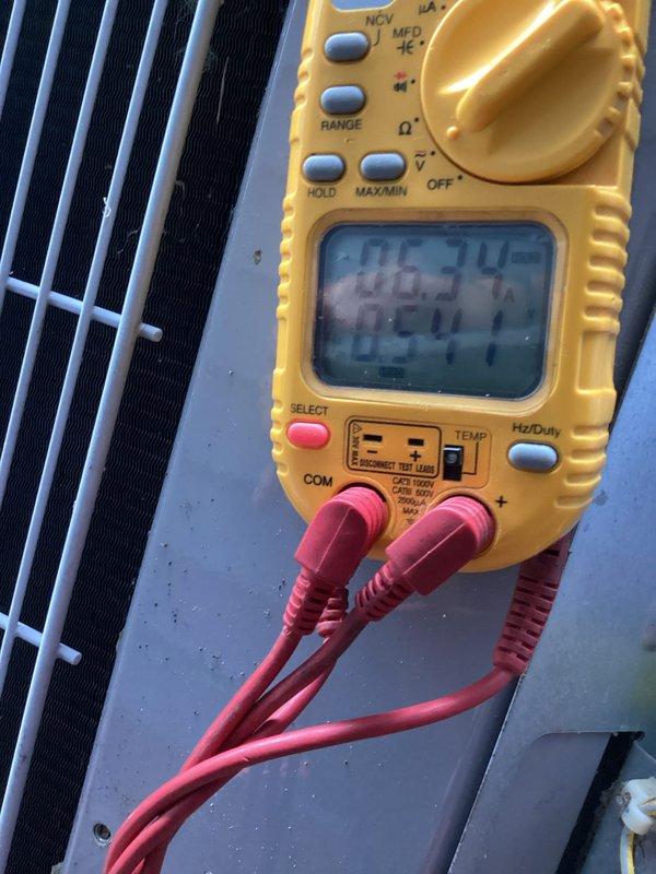 Completed comprehensive HVAC cooling and heating maintenance tune-up on residential system. Performed electrical diagnostics using digital multimeter to measure capacitance readings on outdoor condensing unit, verifying proper compressor and fan motor capacitor values for optimal system performance. All components tested within manufacturer specifications and system operating efficiently.