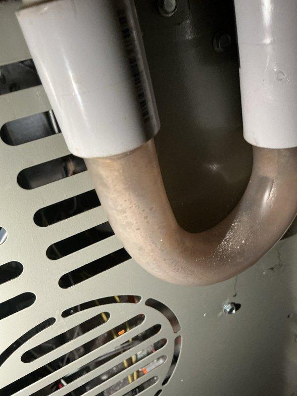Completed cooling season tune-up on residential HVAC system. Performed standard maintenance inspection of equipment including condensate drain assembly and circulator pump connections, verified proper operation of all components, and confirmed system readiness for cooling season.