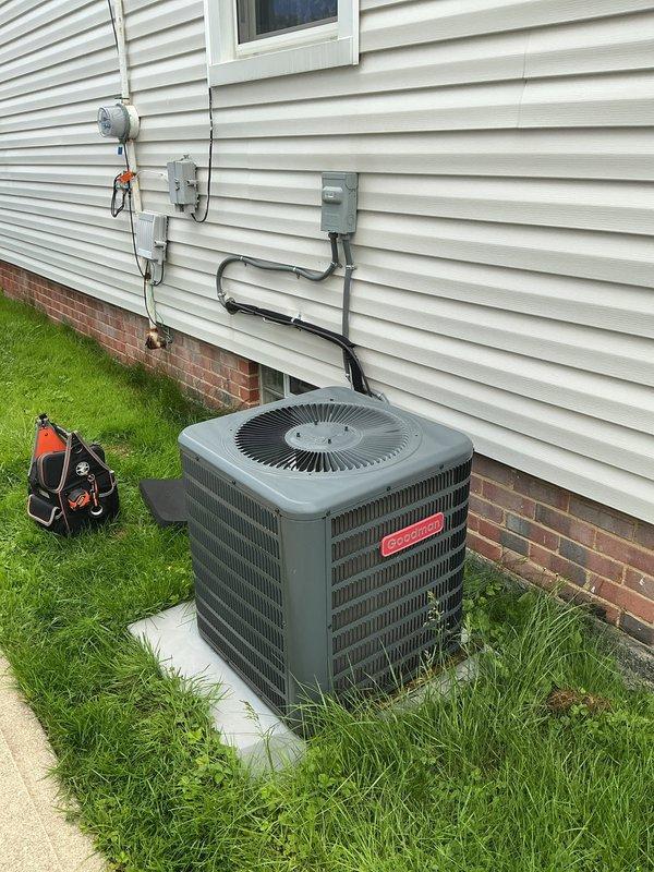 Completed preventative maintenance on residential Goodman air conditioning system. Inspected outdoor condensing unit including compressor, condenser coil, fan motor, and electrical connections. Verified proper operation of indoor air handler and ductwork connections in basement mechanical room. Checked refrigerant lines, electrical disconnect, and all associated components. System operating within normal parameters with no deficiencies noted.