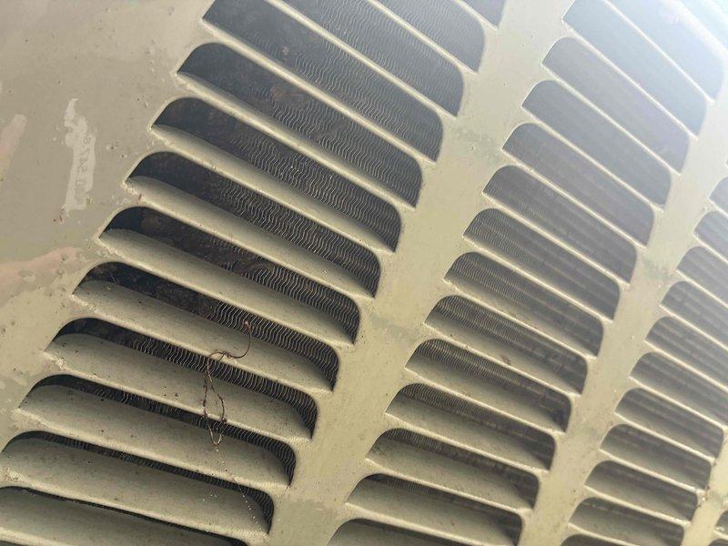 Performed comprehensive cooling system maintenance on HVAC unit. Inspected and documented blower motor assembly, confirming proper operation of squirrel cage fan with all blades intact and motor housing connections secure. Verified electrical connections and wiring at motor terminals. Checked supply and return air vents for proper airflow and clearance, noting standard dust accumulation on components consistent with normal operation.
