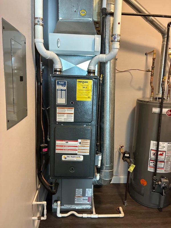 Provided comprehensive full system replacement options for residential HVAC equipment. Documented existing furnace, water heater, ductwork, and ventilation components including PVC venting, flexible ductwork connections, and electrical panel configuration to assess replacement requirements and system specifications.