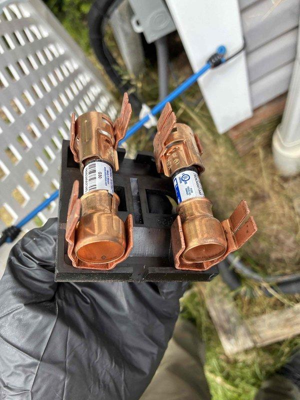 Performed routine cooling system maintenance and hot water tank inspection. Verified electrical parameters using clamp meter, confirming proper voltage and amperage readings at the unit. Inspected and tested fuse assembly, verifying both fuses were intact and functioning correctly with no signs of overheating or degradation.