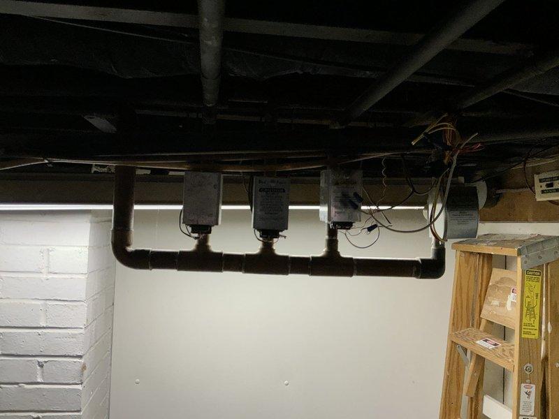 Conducted comprehensive assessment of existing air conditioning system in basement utility area for complete system replacement. Presented three-tier replacement options featuring Goodman AC units with matching evaporator coils, ranging from 13.4 SEER to 16 SEER efficiency ratings, and provided preliminary boiler replacement pricing information per customer request.