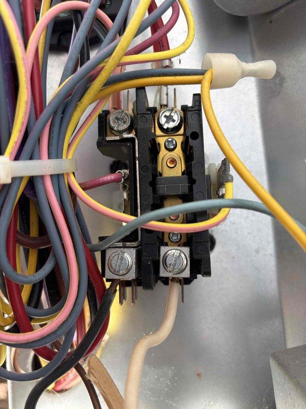 Completed preventative maintenance on two cooling systems. Inspected electrical connections at contactor assembly, verified proper wire termination and secure mounting of all components. Measured and documented supply air temperature at 66.1°F, confirming system operation within normal parameters.