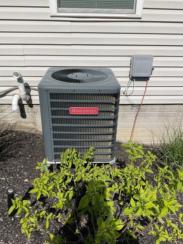 Completed scheduled preventive maintenance on residential cooling system. Inspected Goodman outdoor condenser unit, verifying proper operation of compressor and condenser fan motor. Checked refrigerant pressures and electrical connections at disconnect box. Cleared vegetation growth from around condenser to ensure adequate airflow and prevent future efficiency loss. 

Performed indoor equipment inspection of furnace and air handler. Replaced 20x25x4 Filtrete air filter to maintain proper airflow and indoor air quality. Verified all electrical connections, tested thermostat operation, and confirmed proper condensate drainage through PVC piping system. System operating within normal parameters with no deficiencies noted.