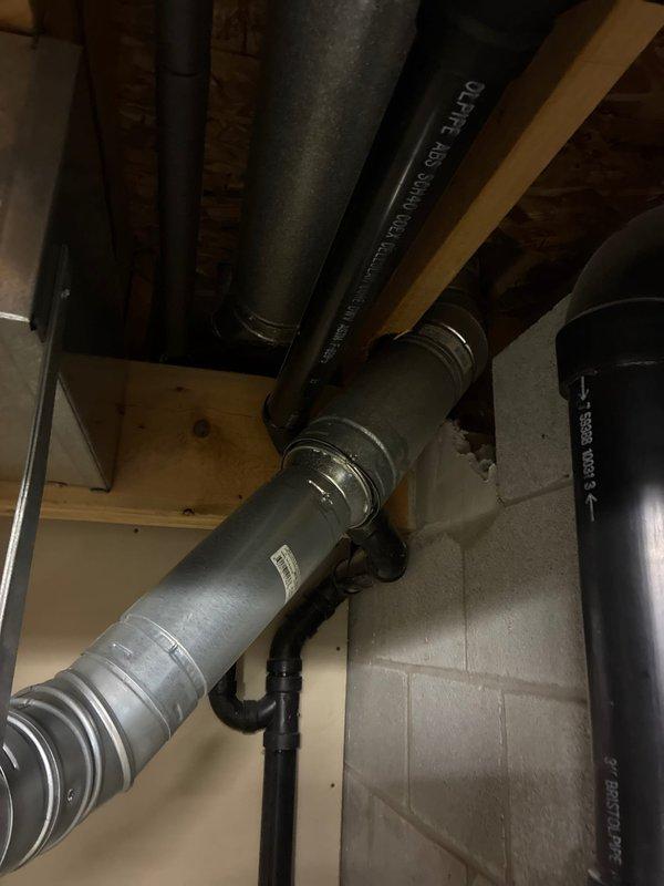 Conducted HVAC equipment evaluation and presented replacement options for existing air handler system in basement mechanical room. Documented current equipment configuration including ductwork connections, existing infrastructure, and installation requirements for potential system upgrade. Assessed mechanical room layout and existing plumbing/electrical components to determine optimal replacement specifications and buyback considerations for the homeowner's decision-making process.