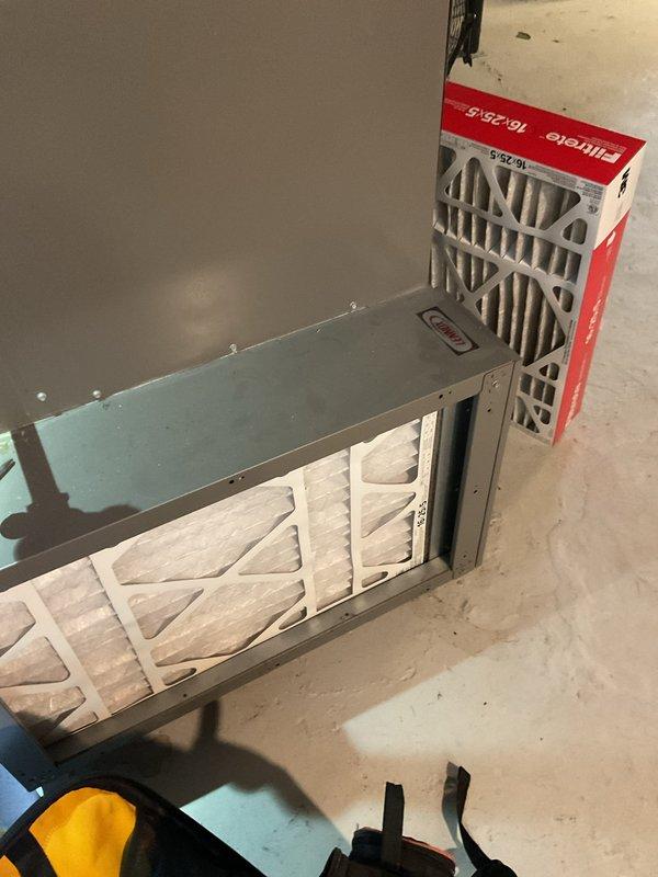 Completed routine HVAC cooling system maintenance including inspection of basement ductwork infrastructure and air filtration system. Replaced 16x25x5 pleated air filters in the metal housing unit to ensure optimal airflow and system efficiency for the upcoming cooling season.