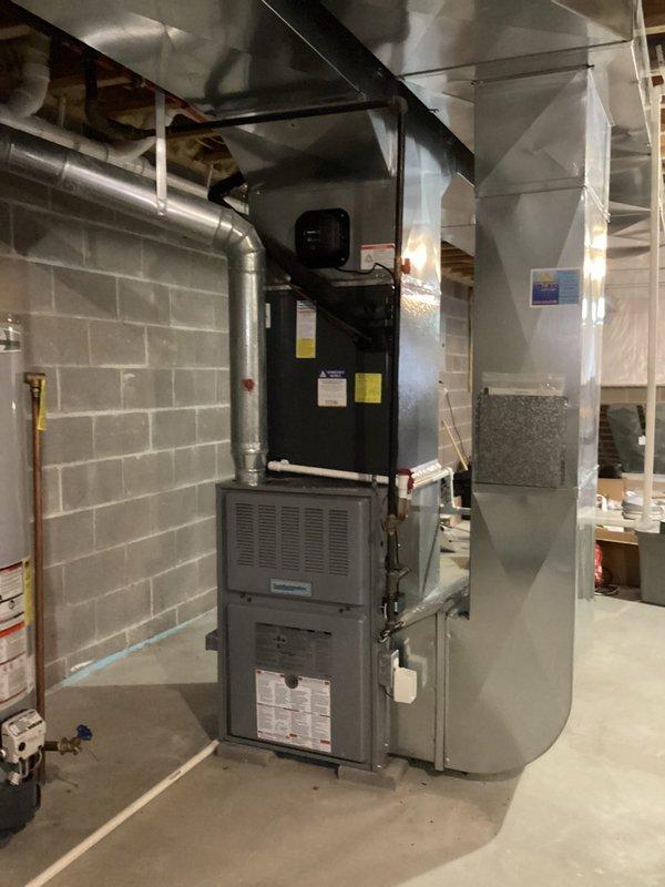 Completed scheduled cooling system maintenance on residential HVAC unit located in basement mechanical room. Performed comprehensive inspection of furnace, air handler, and associated ductwork, verifying proper operation of all components. Replaced air filter with new unit, removing old filter that showed normal dust accumulation from regular use. Inspected metallic ductwork connections, flexible ducting, and insulated vertical runs for proper sealing and airflow. All equipment found to be operating within normal parameters with no issues detected. System is ready for cooling season operation.