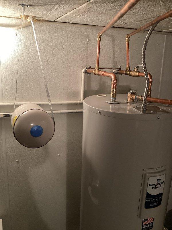 Responded to warranty call for newly installed Bradford White water heater with no hot water to showers. Upon inspection, verified proper installation of unit with expansion tank, copper supply lines, brass shut-off valves, and flexible connectors all correctly configured. Troubleshot system, identified and resolved issue preventing hot water delivery to fixtures, and confirmed full hot water restoration to all shower locations.