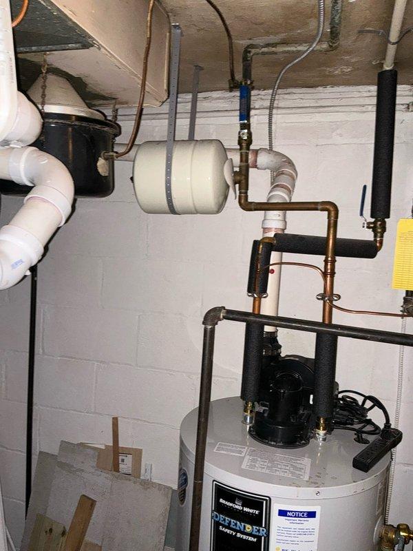 Conducted on-site HVAC system assessment and provided replacement options for residential air conditioning equipment. Documented existing utility room configuration including water heater, plumbing infrastructure, and electrical panel specifications to determine compatibility requirements for new AC installation.