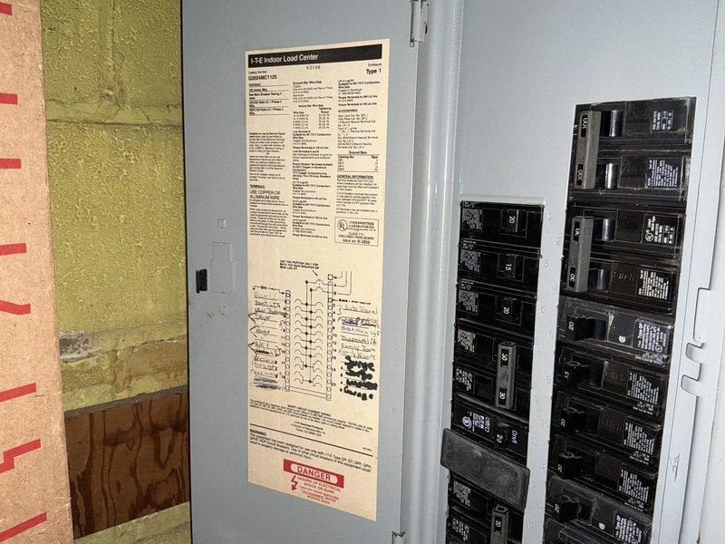 Conducted on-site HVAC system assessment and provided replacement options for residential air conditioning equipment. Documented existing utility room configuration including water heater, plumbing infrastructure, and electrical panel specifications to determine compatibility requirements for new AC installation.
